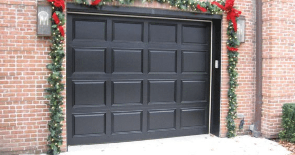 garage door with string lights and ornaments